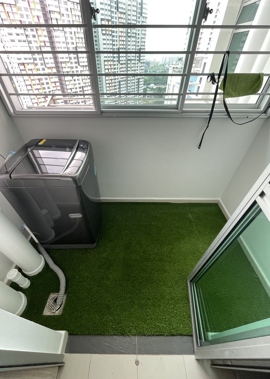 Artificial grass installed in an HDB service yard
